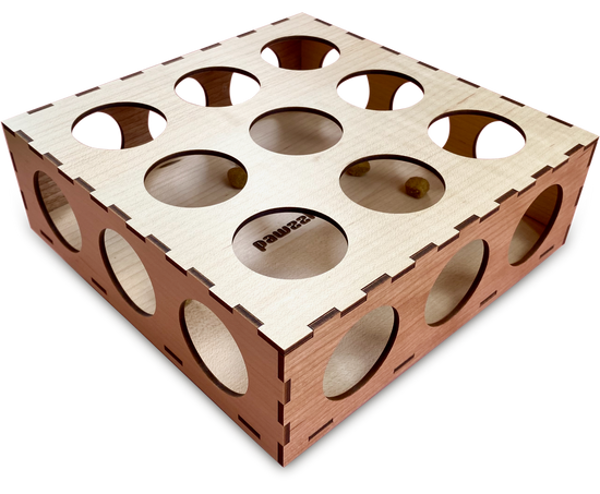 A square wooden Pawzzle box made of Maple and Cherry wood veneer. There are 3 rows of 3 holes in the top and 3 holes on all 4 sides. The Pawzzle sits at an angle making it more of a diamond shape.